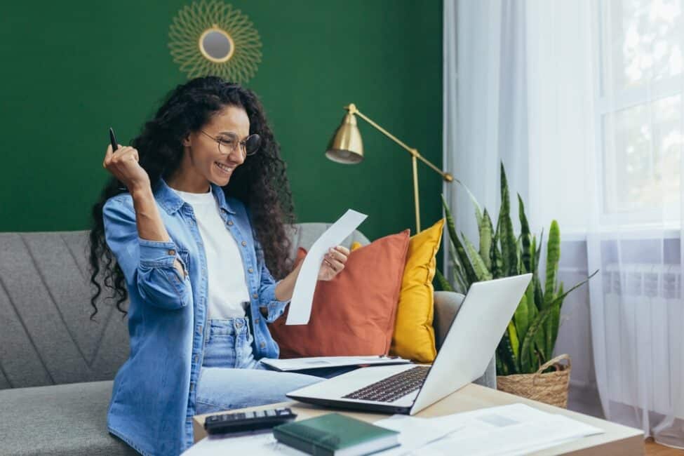 Happy teacher excited about qualifying teacher expenses