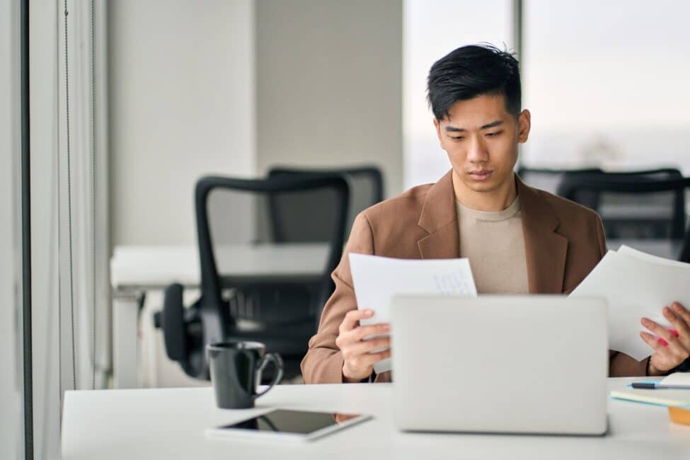 Man reviewing tax documents during filing season