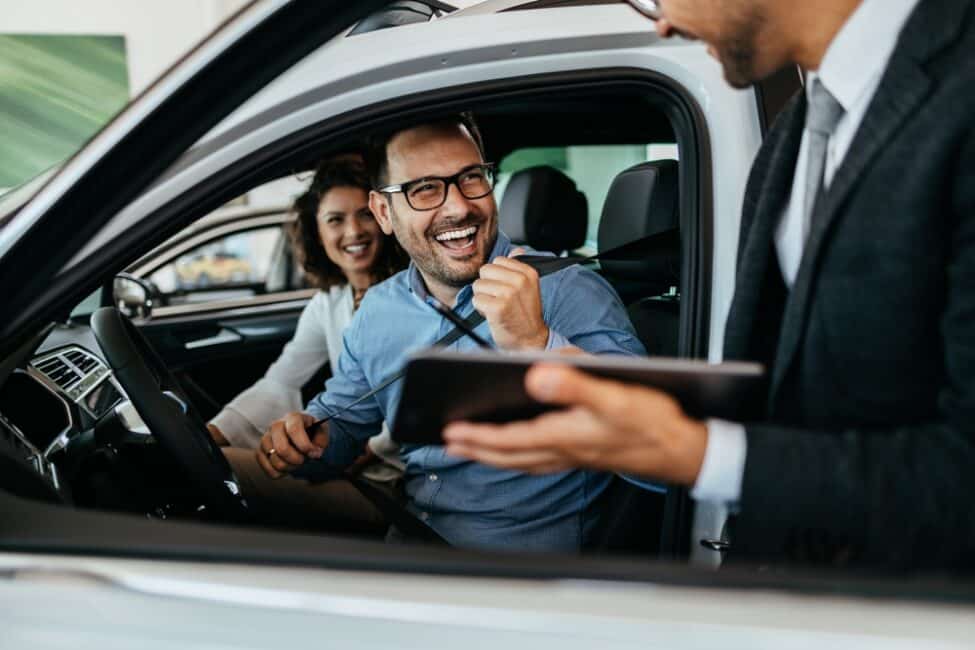 Couple excited to buy a new car