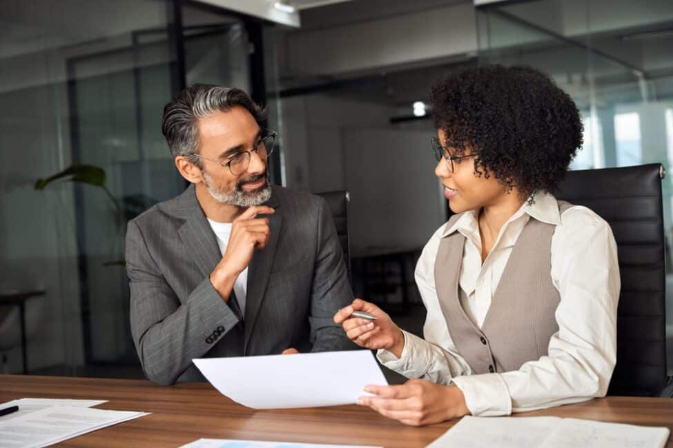 Man meeting with a tax preparation specialist to discuss state taxes