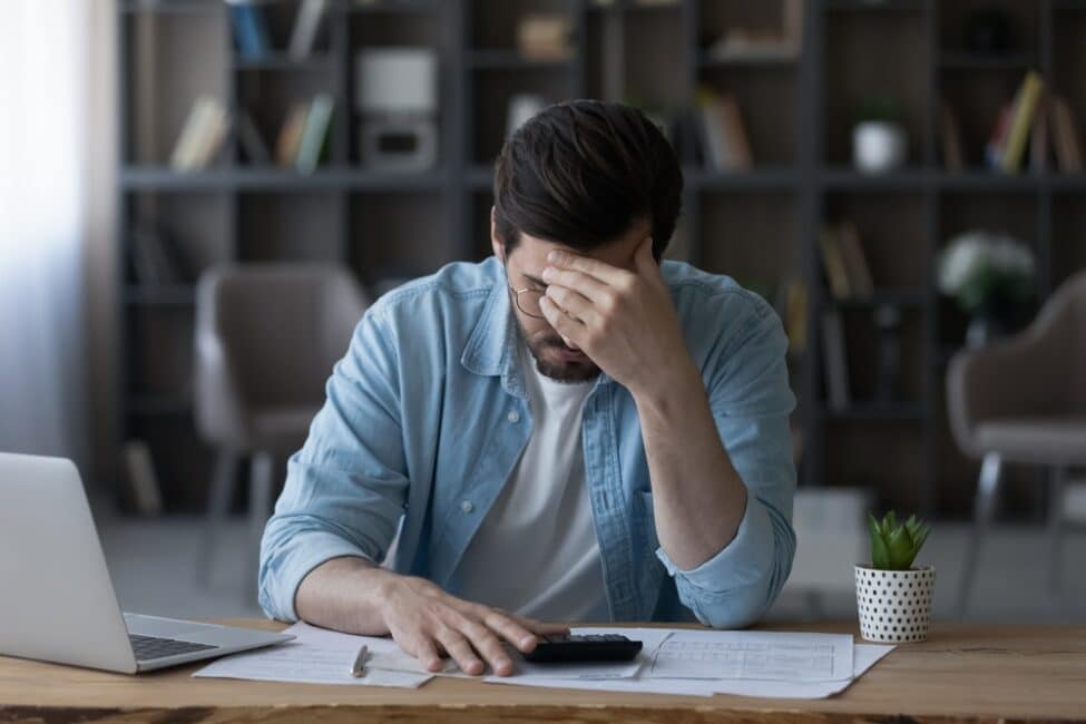 Man stressed from the cons of debt consolidation loans